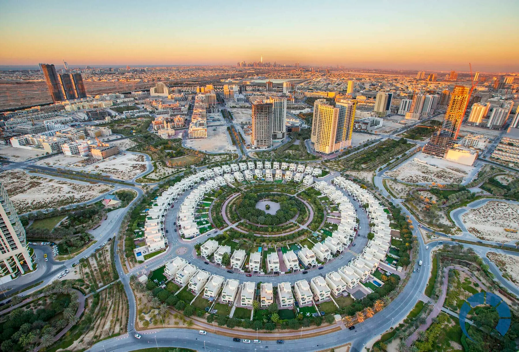 Aerial view of Jumeirah Village Circle showing its circular residential layout